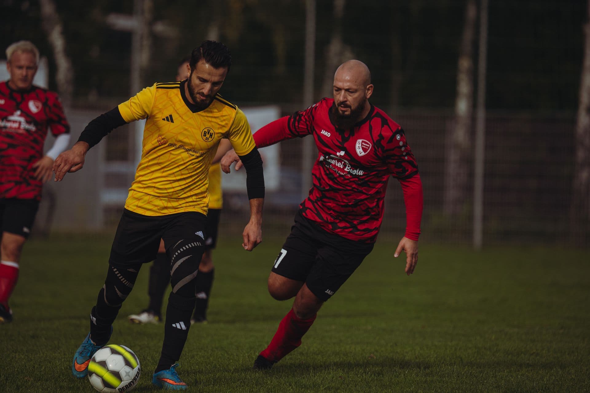 Old guys playing football